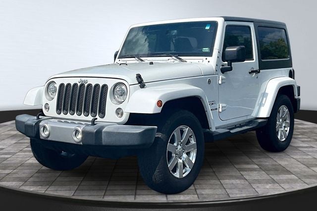 2017 Jeep Wrangler Sahara in Bright White Clearcoat — front three-quarter view