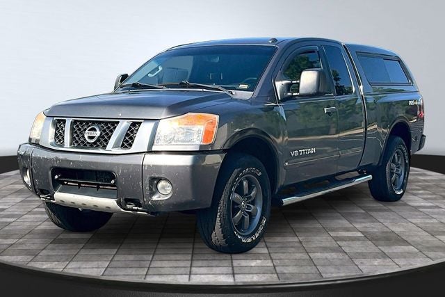 2013 Nissan Titan PRO-4X in Gun Metallic Pearl Metallic — front three-quarter view