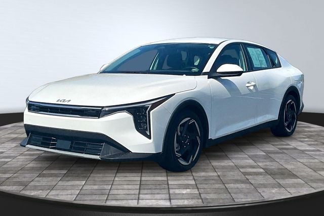 2025 Kia K4 EX in Snow White Pearl — front three-quarter view