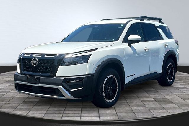 2024 Nissan Pathfinder Rock Creek in Glacier White — front three-quarter view