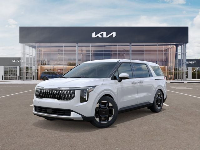 2026 Kia Carnival EX in Snow White Pearl — front three-quarter view