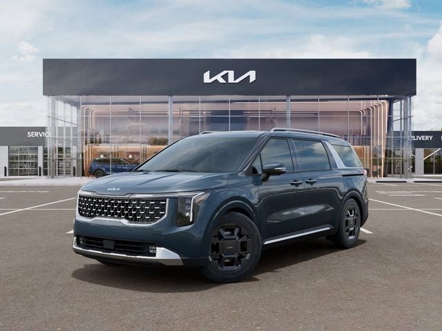 2026 Kia Carnival SX in Astra Blue — front three-quarter view
