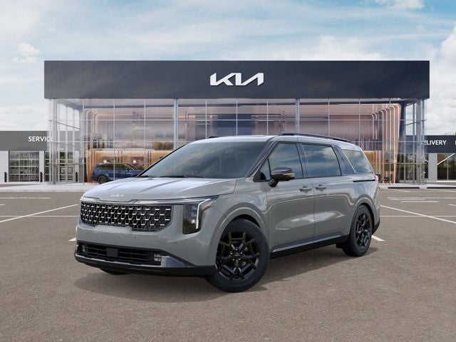 2026 Kia Carnival SX in Ceramic Silver — front three-quarter view
